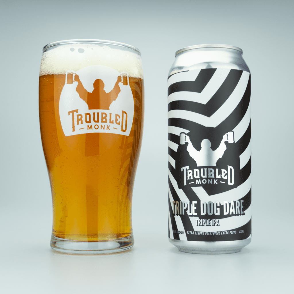 pint picture of triple dog dare triple ipa with a golden hue