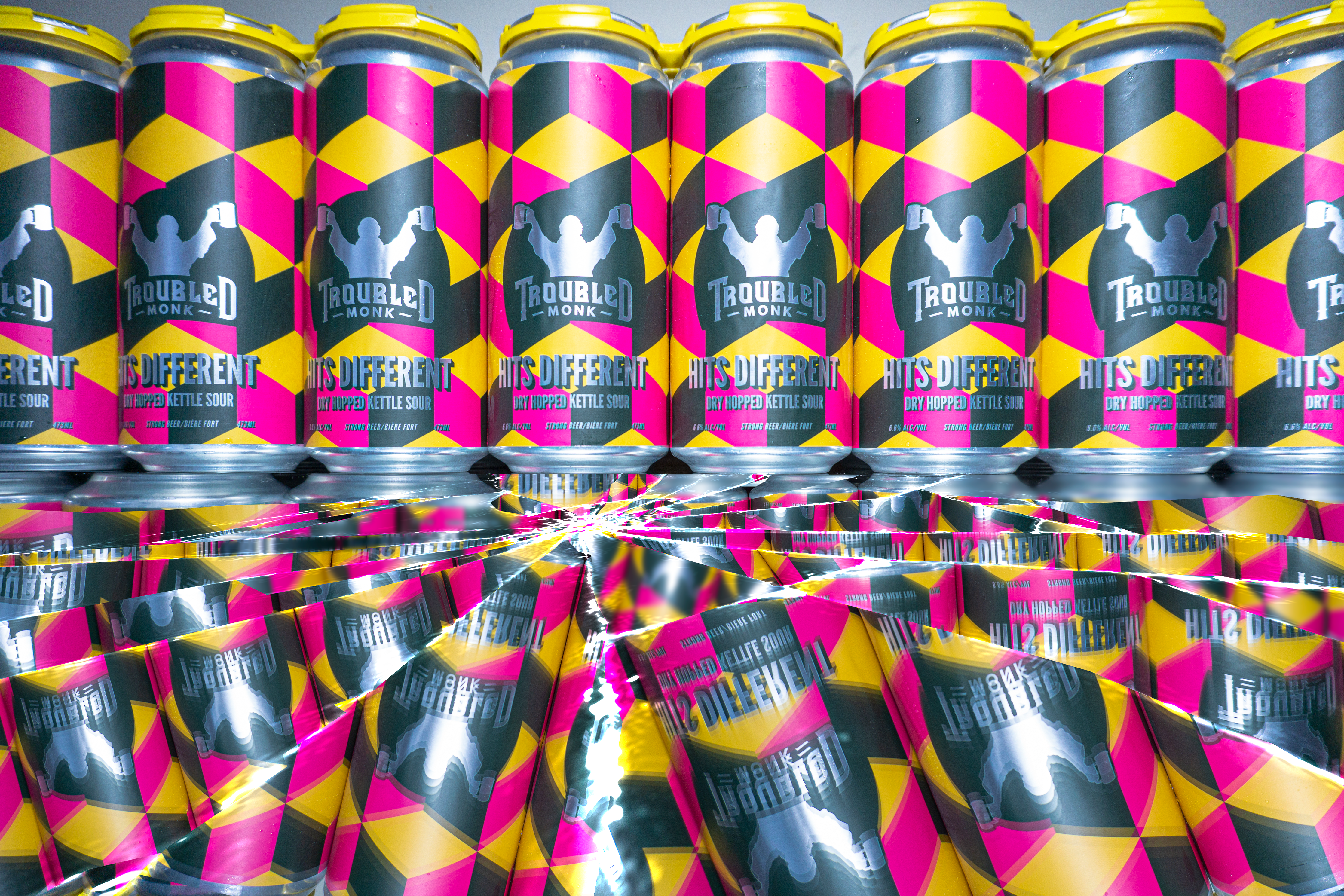 Hits different cans with a qbert pattern of yellow. pink and black